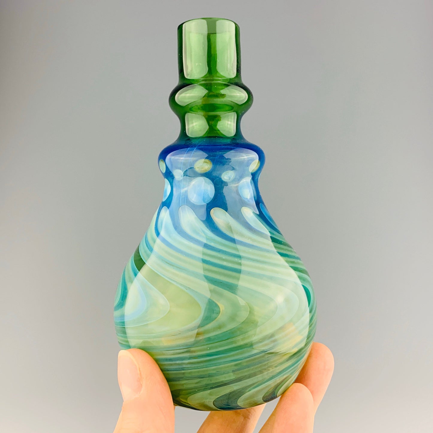 Green and Silver Oil Bottle