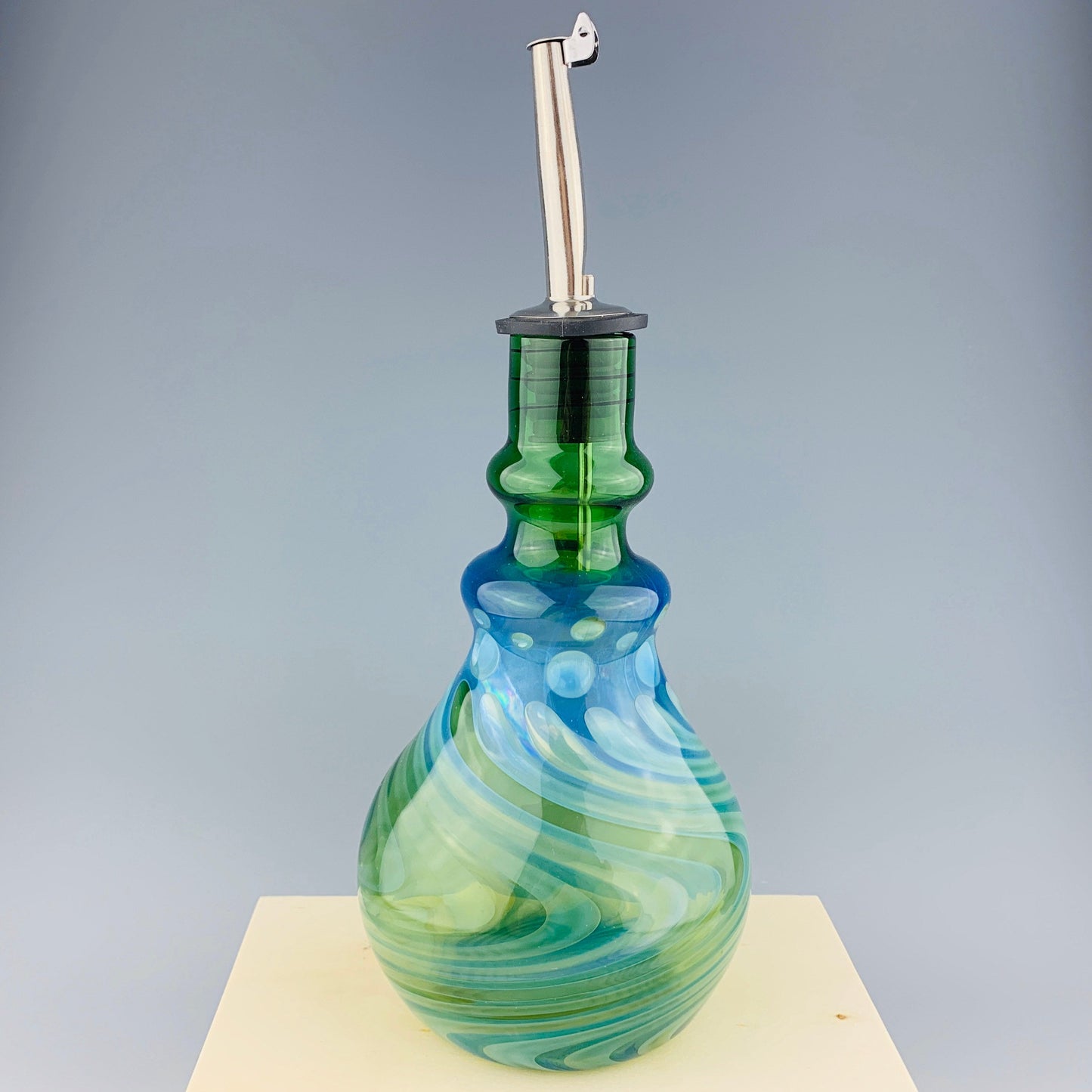 Green and Silver Oil Bottle