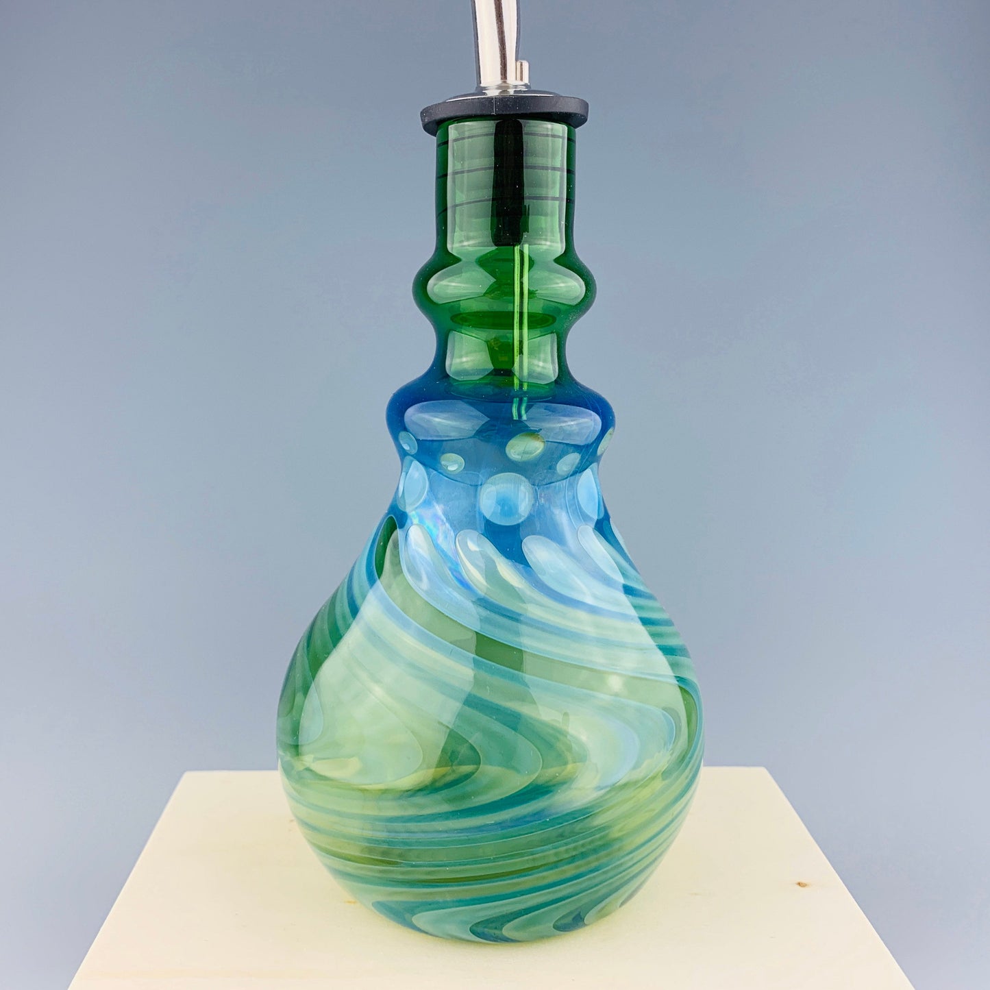 Green and Silver Oil Bottle