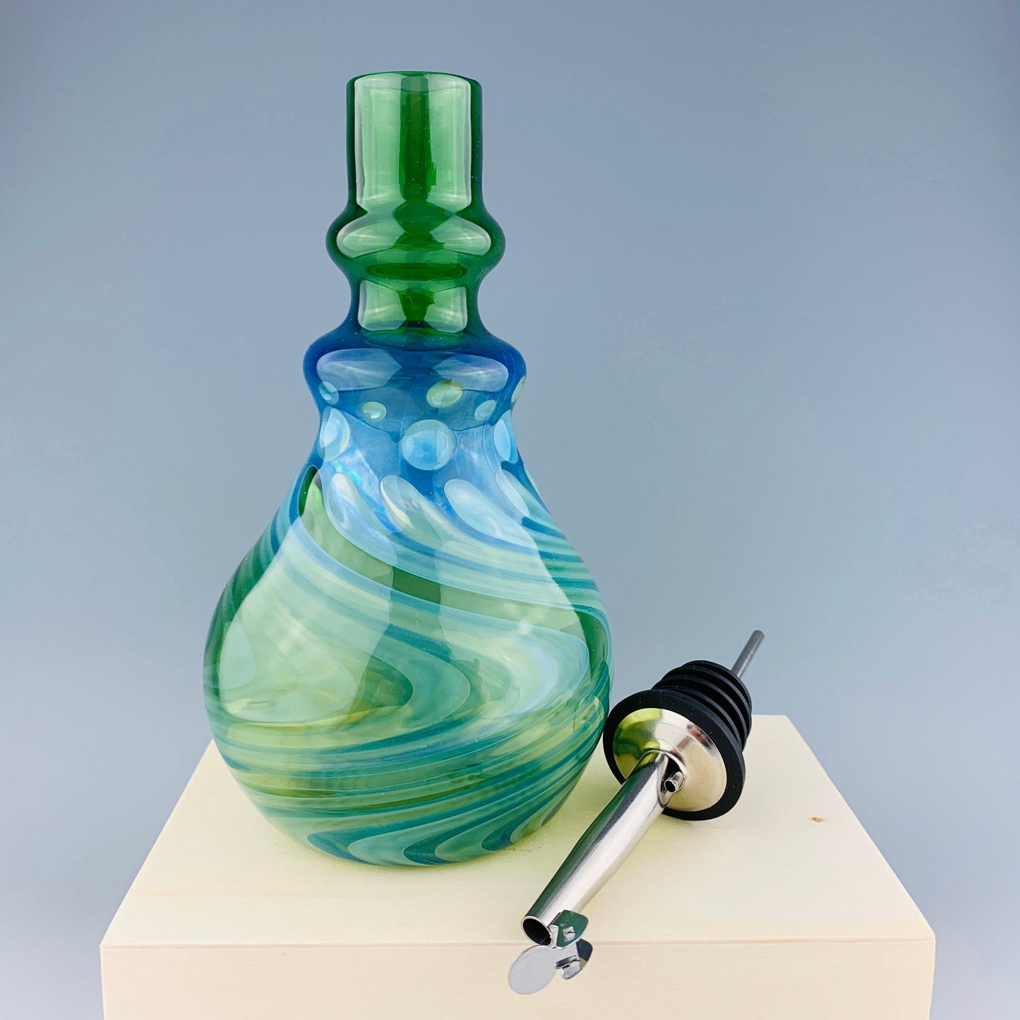 Green and Silver Oil Bottle